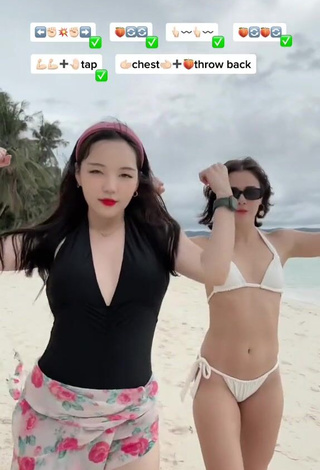 6. Sultry Dasuri Choi Shows Cleavage in Black Swimsuit at the Beach (Side Boob)