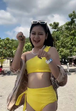 5. Titillating Eya Borja Shows Cleavage in Yellow Bikini