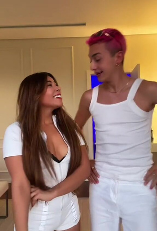 2. Titillating Ingrid Ohara Shows Cleavage in White Overall (Side Boob)