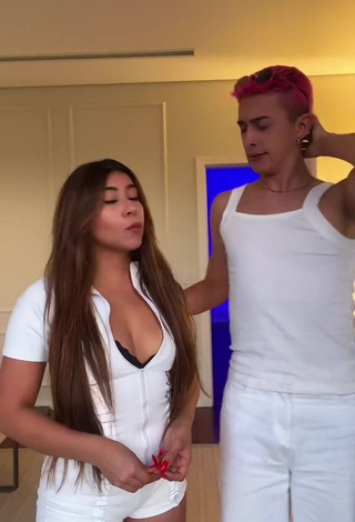 4. Titillating Ingrid Ohara Shows Cleavage in White Overall (Side Boob)