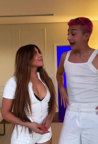 6. Titillating Ingrid Ohara Shows Cleavage in White Overall (Side Boob)