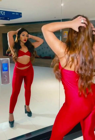 2. Luscious Ingrid Ohara Shows Cleavage in Red Overall (Underboob)