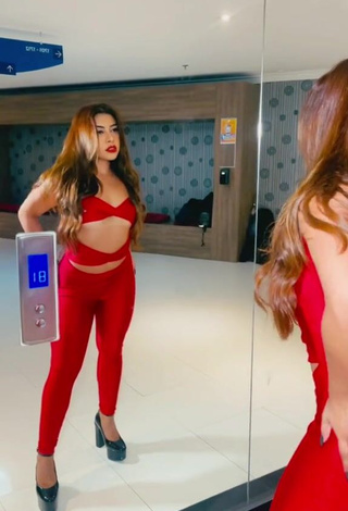 3. Luscious Ingrid Ohara Shows Cleavage in Red Overall (Underboob)