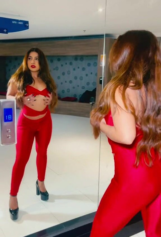 4. Luscious Ingrid Ohara Shows Cleavage in Red Overall (Underboob)