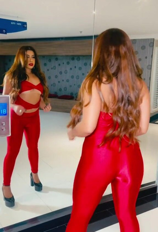 5. Luscious Ingrid Ohara Shows Cleavage in Red Overall (Underboob)