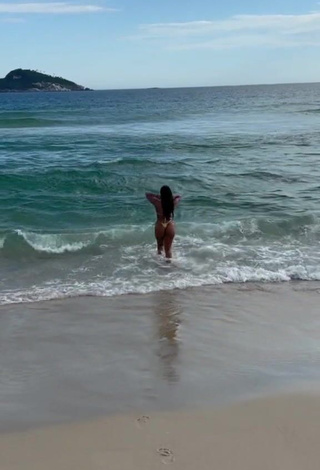 3. Hot Ingrid Ohara in Thong at the Beach (Side Boob)