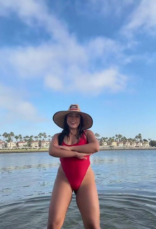 3. Sultry Ingrid Ohara Shows Cleavage in Red Swimsuit