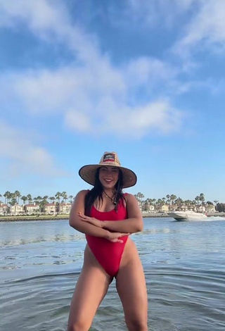 4. Sultry Ingrid Ohara Shows Cleavage in Red Swimsuit