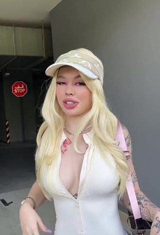 6. Hot Instasamka Shows Cleavage in White Overall (Side Boob)