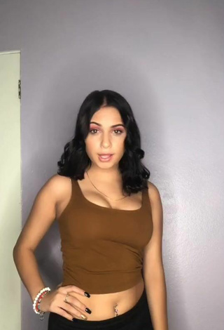 Pretty Kassie Torres Shows Cleavage in Brown Crop Top