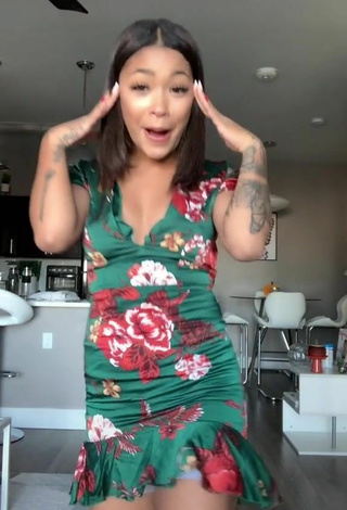 5. Sultry Leilani Green in Floral Dress