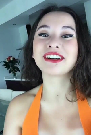 3. Luscious Maria Reus Huang in Orange Top