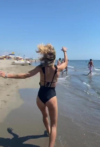 Luscious Martina Picardi in Black Swimsuit at the Beach