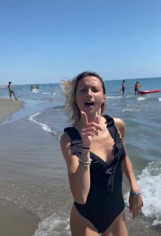 3. Luscious Martina Picardi in Black Swimsuit at the Beach