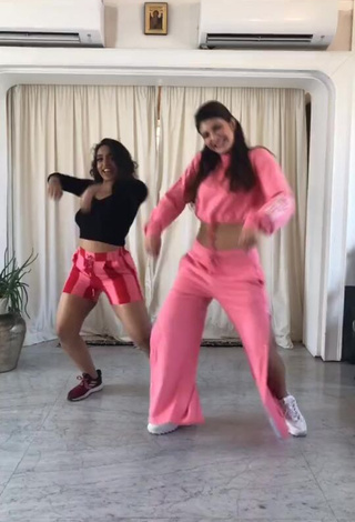 Titillating Jacqueline Fernandez in Peach Crop Top