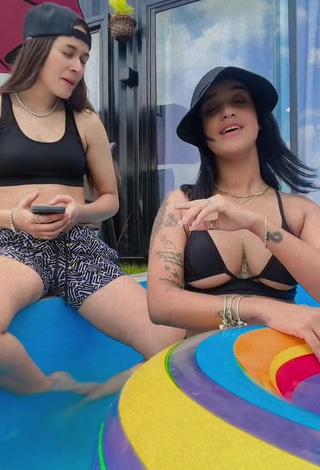 3. Gorgeous Jenny Camacho Shows Cleavage in Alluring Black Bikini Top (Underboob)