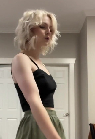 6. Sexy Kris Collins Shows Cleavage in Black Crop Top