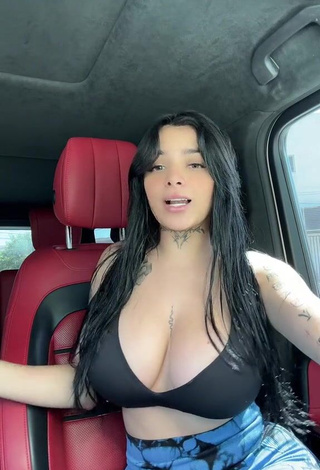 2. Sultry Karely Ruiz Shows Cleavage in Black Sport Bra in a Car (Side Boob)