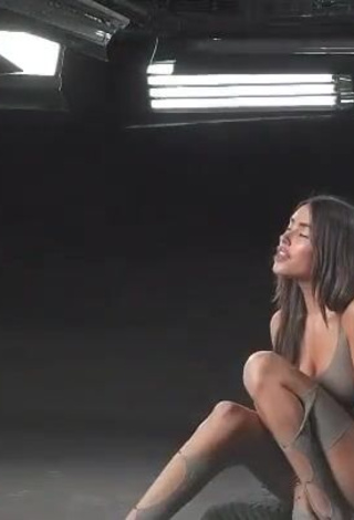 Sultry Madison Beer Shows Cleavage in Grey Overall