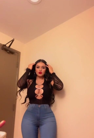 2. Luscious Marlene Santana Shows Cleavage in Black Top (Side Boob)