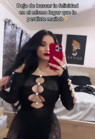 2. Titillating Marlene Santana Shows Cleavage in Black Overall (Side Boob)