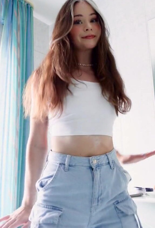 4. Seductive Nadine Breaty in White Crop Top