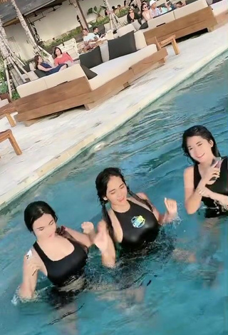 6. Luscious Angguncantik Shows Cleavage in Black Swimsuit at the Swimming Pool