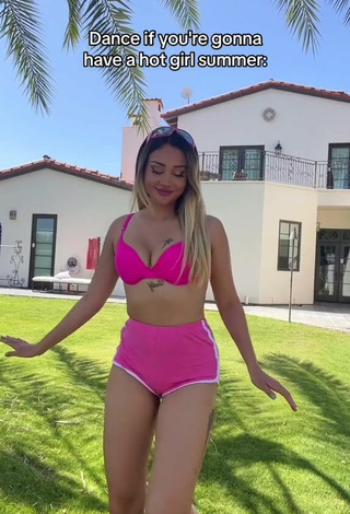 Sultry Star Abelar Shows Cleavage in Pink Bikini Top