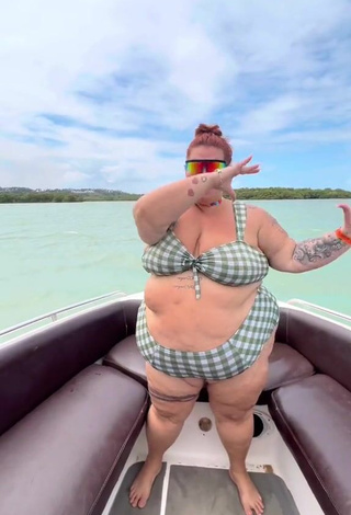 2. Magnetic Thais Carla Shows Cleavage in Appealing Checkered Bikini on a Boat