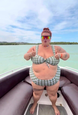 3. Magnetic Thais Carla Shows Cleavage in Appealing Checkered Bikini on a Boat