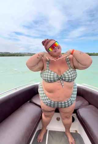 4. Magnetic Thais Carla Shows Cleavage in Appealing Checkered Bikini on a Boat