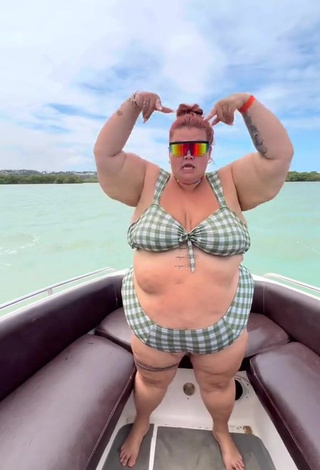 5. Magnetic Thais Carla Shows Cleavage in Appealing Checkered Bikini on a Boat