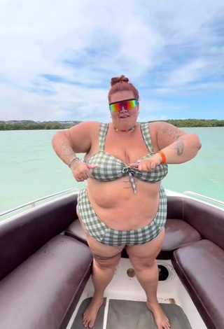 6. Magnetic Thais Carla Shows Cleavage in Appealing Checkered Bikini on a Boat