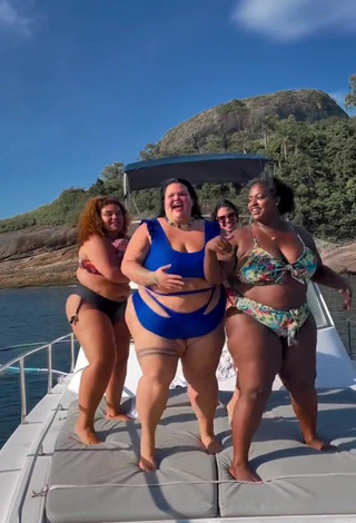 5. Luscious Thais Carla Shows Cleavage in Blue Swimsuit on a Boat