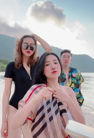 Luscious Việt Phương Thoa Shows Cleavage in Black Bodysuit at the Beach