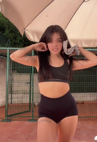 2. Luscious Xinni Xinnita Shows Cleavage in Black Sport Bra