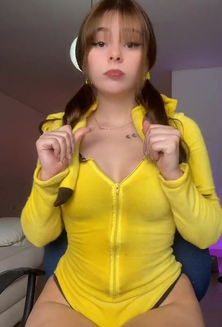 3. Sultry Yarely Alexandra Shows Cleavage in Yellow Bodysuit