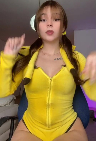 4. Sultry Yarely Alexandra Shows Cleavage in Yellow Bodysuit