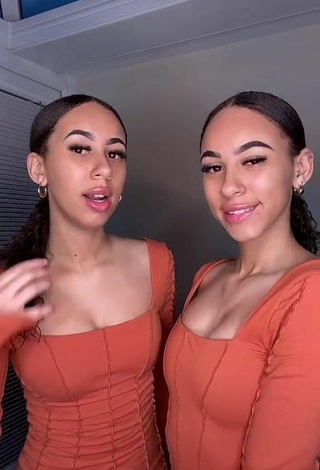 Sultry Nel.Twinnys in Orange Dress