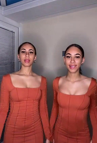 2. Sultry Nel.Twinnys in Orange Dress