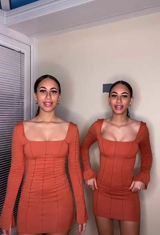 3. Sultry Nel.Twinnys in Orange Dress