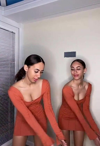 5. Sultry Nel.Twinnys in Orange Dress