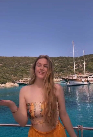 Sultry Tessa Bear in Snake Print Bikini Top on a Boat