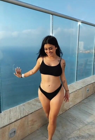 2. Sultry Fernanda Ortega in Black Bikini on the Balcony