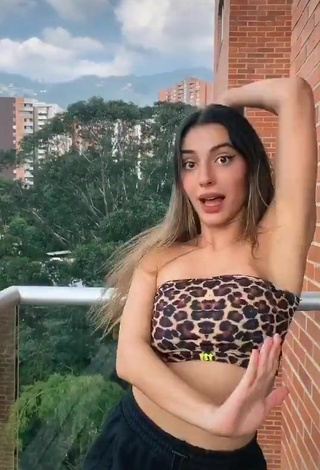 4. Sultry Isabela Delgado Urreta in Leopard Tube Top on the Balcony