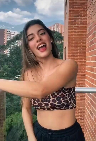 5. Sultry Isabela Delgado Urreta in Leopard Tube Top on the Balcony