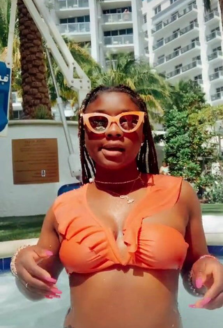 2. Sultry Aba Asante in Orange Bikini at the Swimming Pool