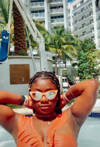 3. Sultry Aba Asante in Orange Bikini at the Swimming Pool