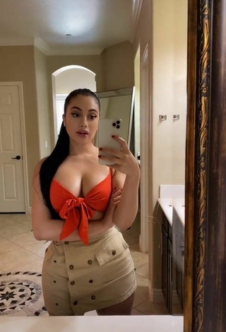 Sweetie Jailyne Ojeda Ochoa Shows Cleavage in Orange Crop Top