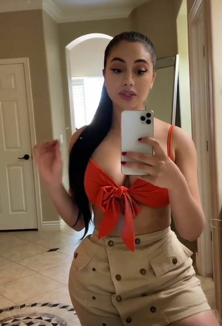 3. Sweetie Jailyne Ojeda Ochoa Shows Cleavage in Orange Crop Top